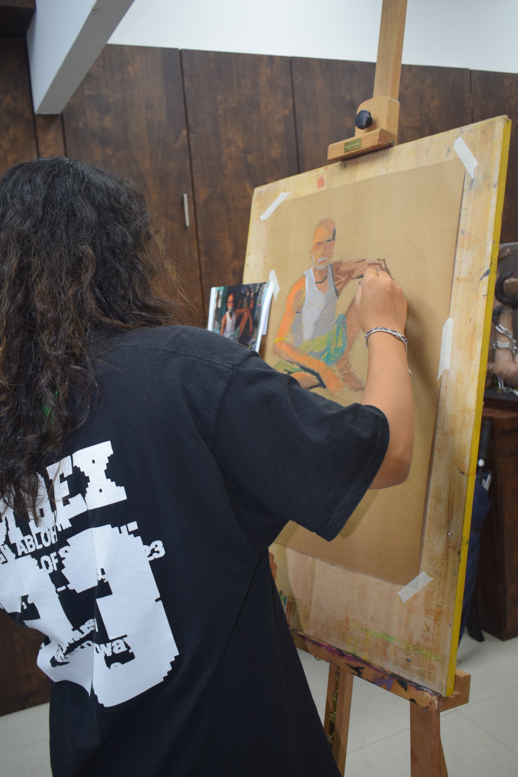 Student painting in an art studio
