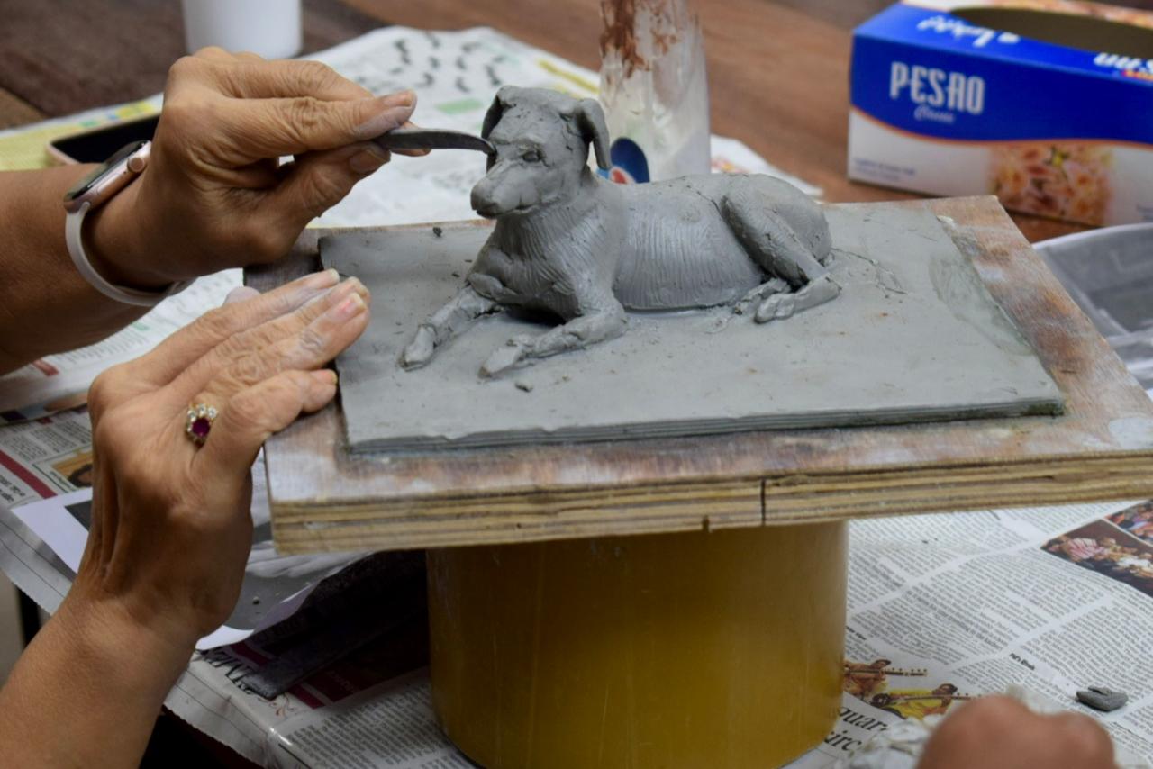 Student working on sculpture